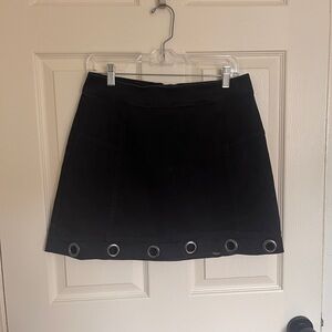 Material Girl Black Mini Skirt with Gunmetal Grommet Detail